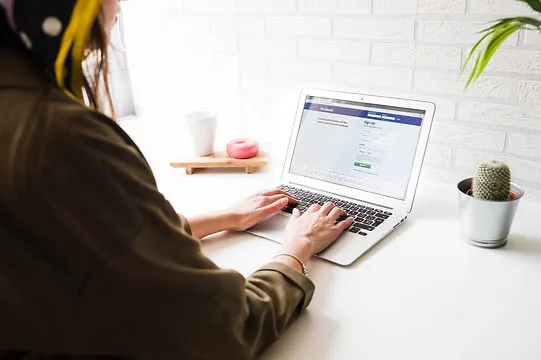 Image depicting an individual engaging with social media platforms, representing the service of setting up and managing social media accounts for clients